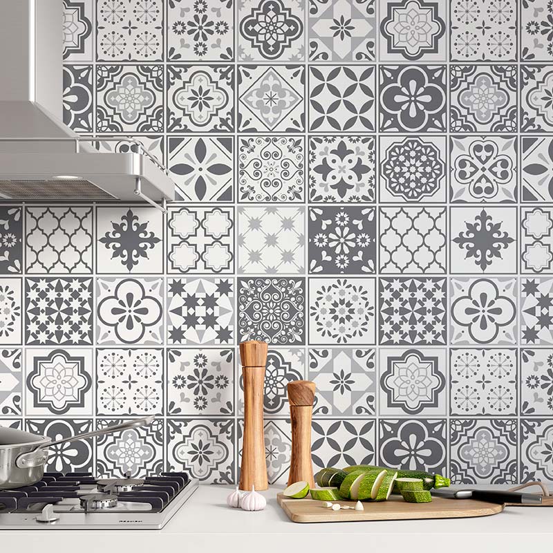Grey patterned tile design vinyl wrap used as a kitchen backsplash